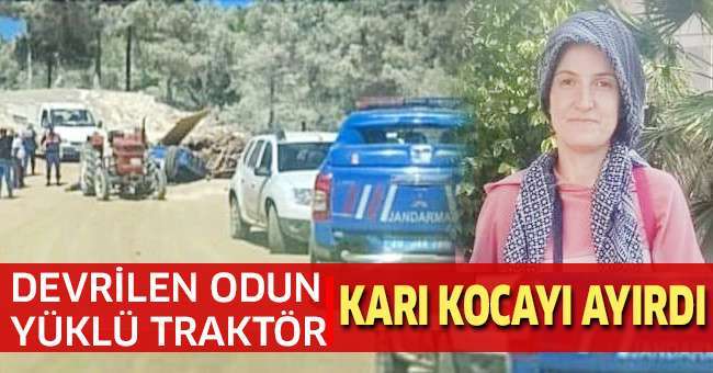 Devrilen odun yüklü traktör, karı kocayı ayırdı